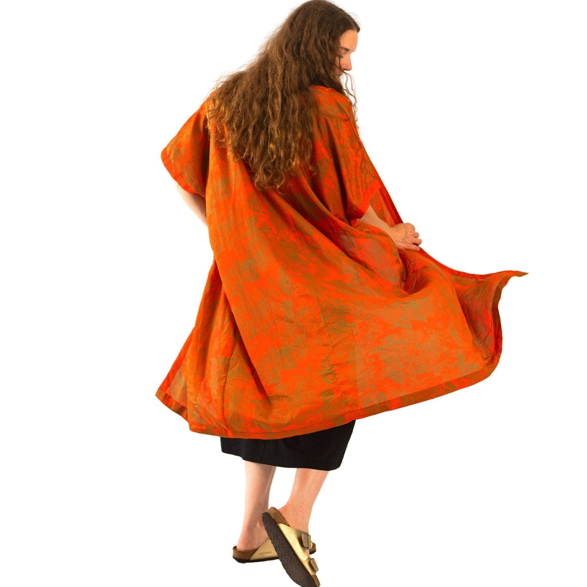 model wearing long orange duster