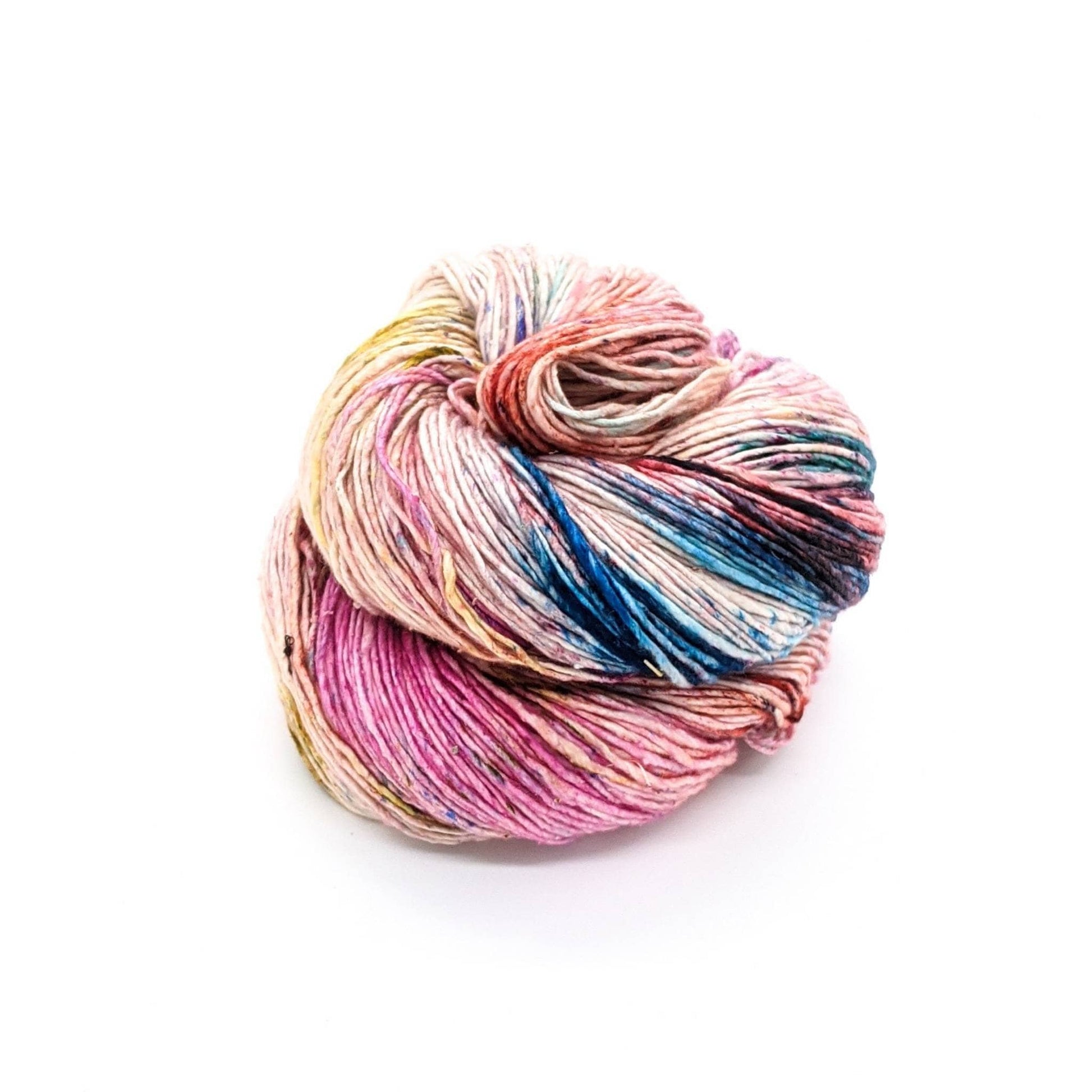 Sport weight silk yarn in Confetti (pink, yellow, blue and white) in front of white background.