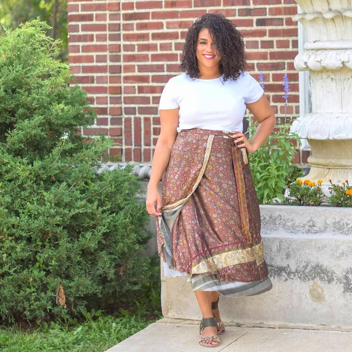 A woman wearing a sari wrap skirt.