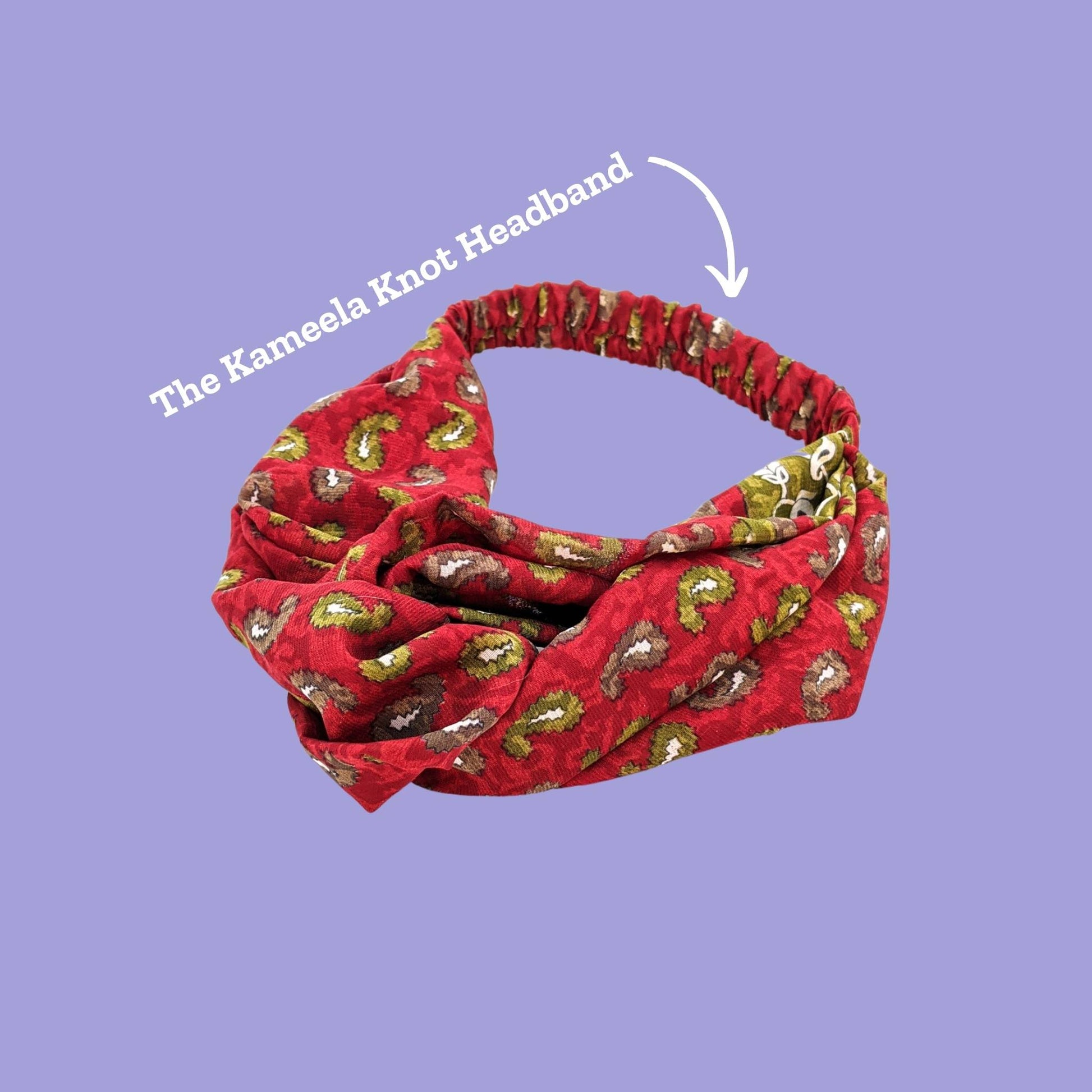 A red and yellow kameela knot headband on a purple background. An arrow points and reads The Kameela Knot Headband.