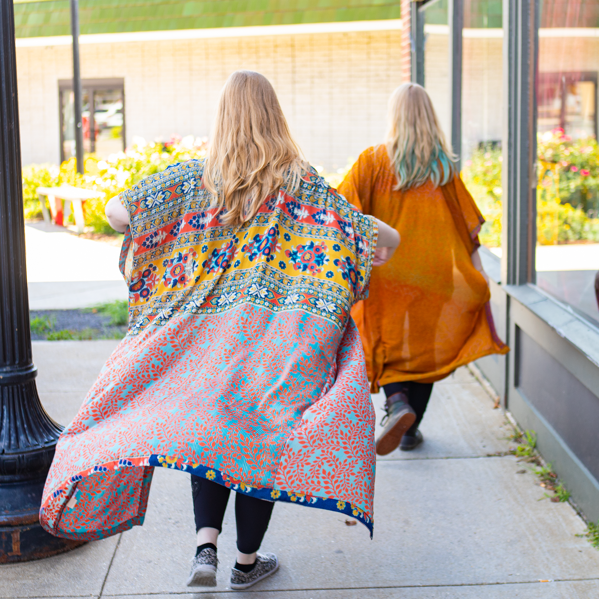 back view of Models wearing amara long recycled sari duster.