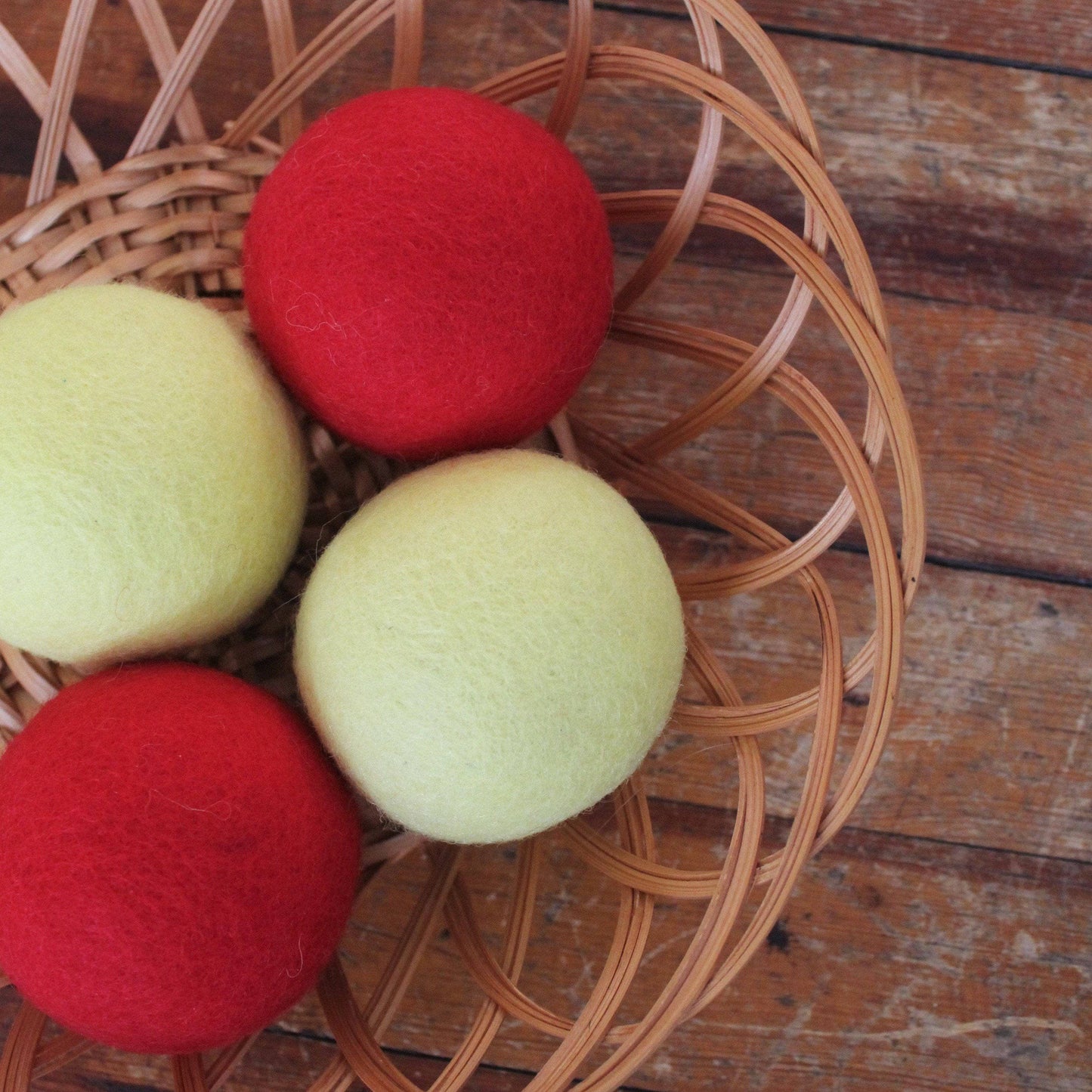 Colorful wool balls in woven basket