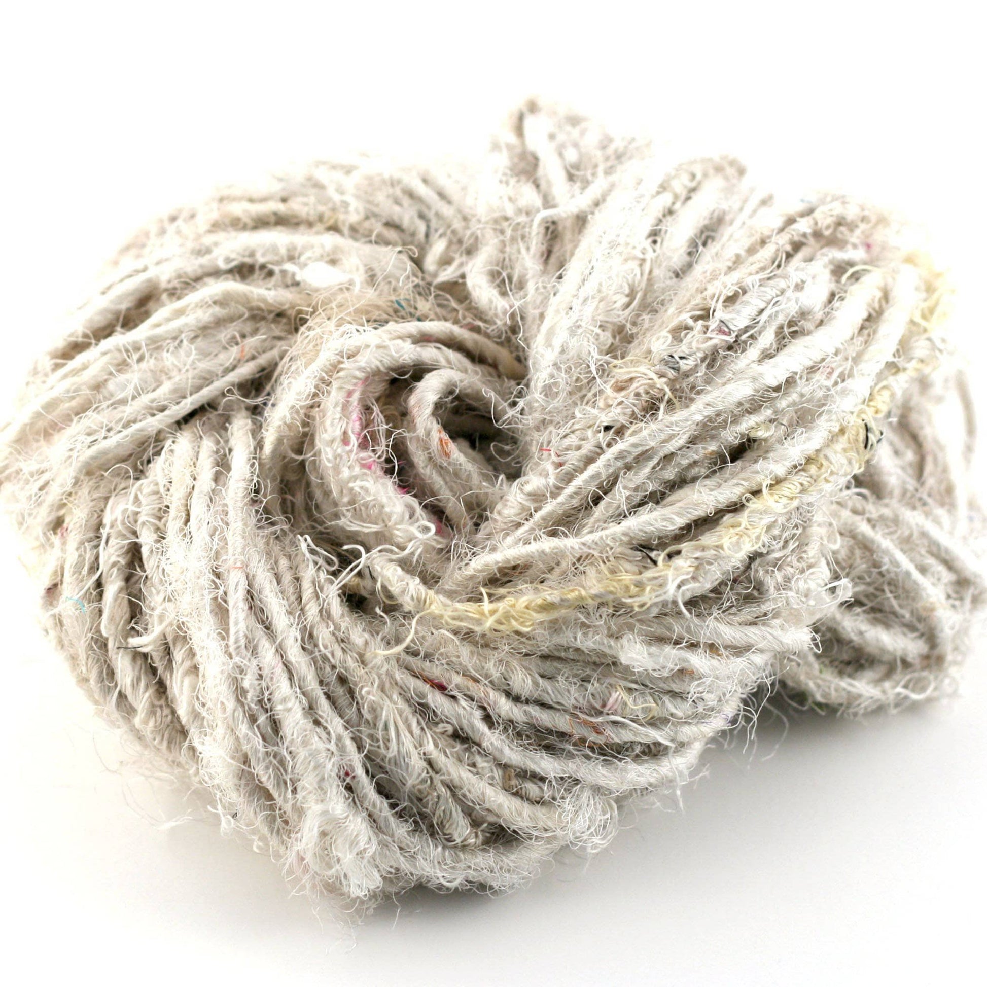 Recycled Silk Handspun Yarn "Lux Adventure" close up in the color "White Cream" with a white background