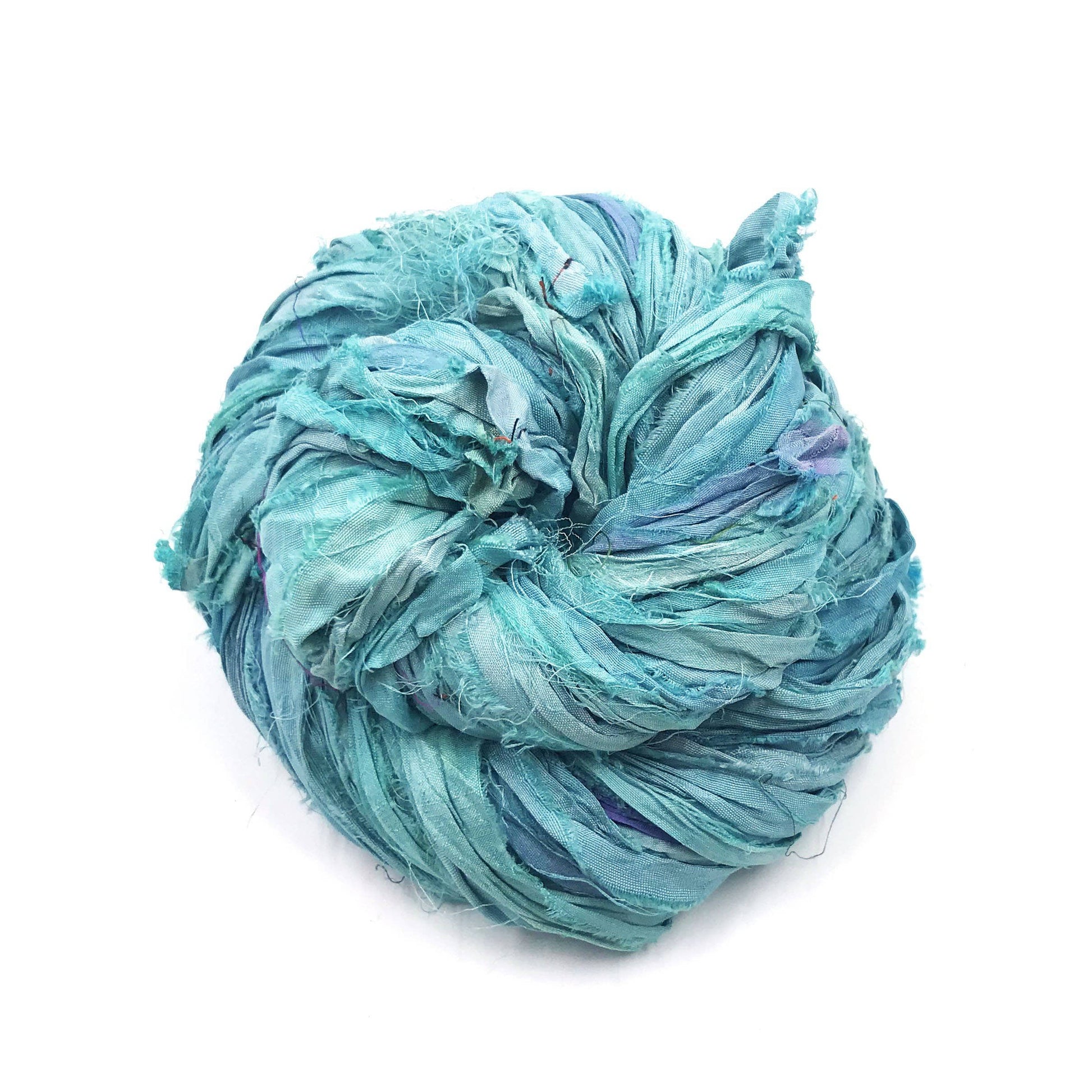 A light blue skein of sari ribbon on a white background
