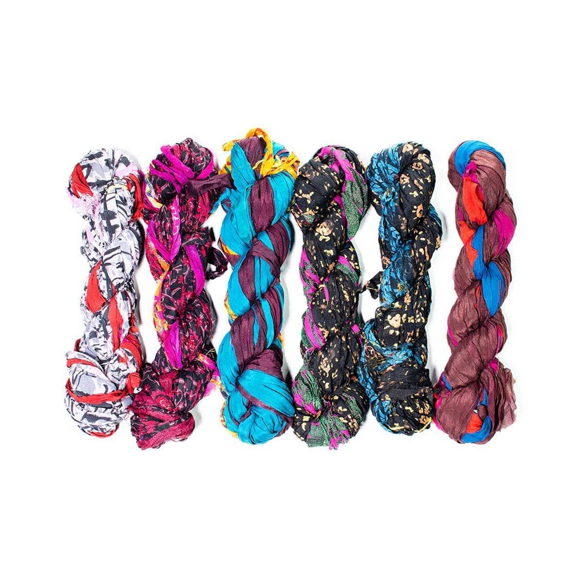 Black, Dark Redcolored skeins of chiffon ribbon on a white background