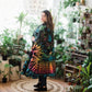 A woman sanding wearing cotton tie dye long cardigan.