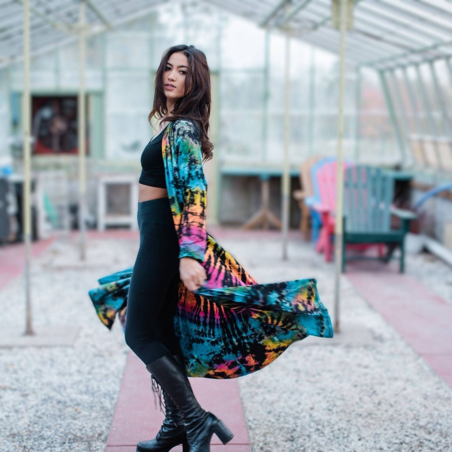 A woman wearing a cotton tie dye long cardigan.