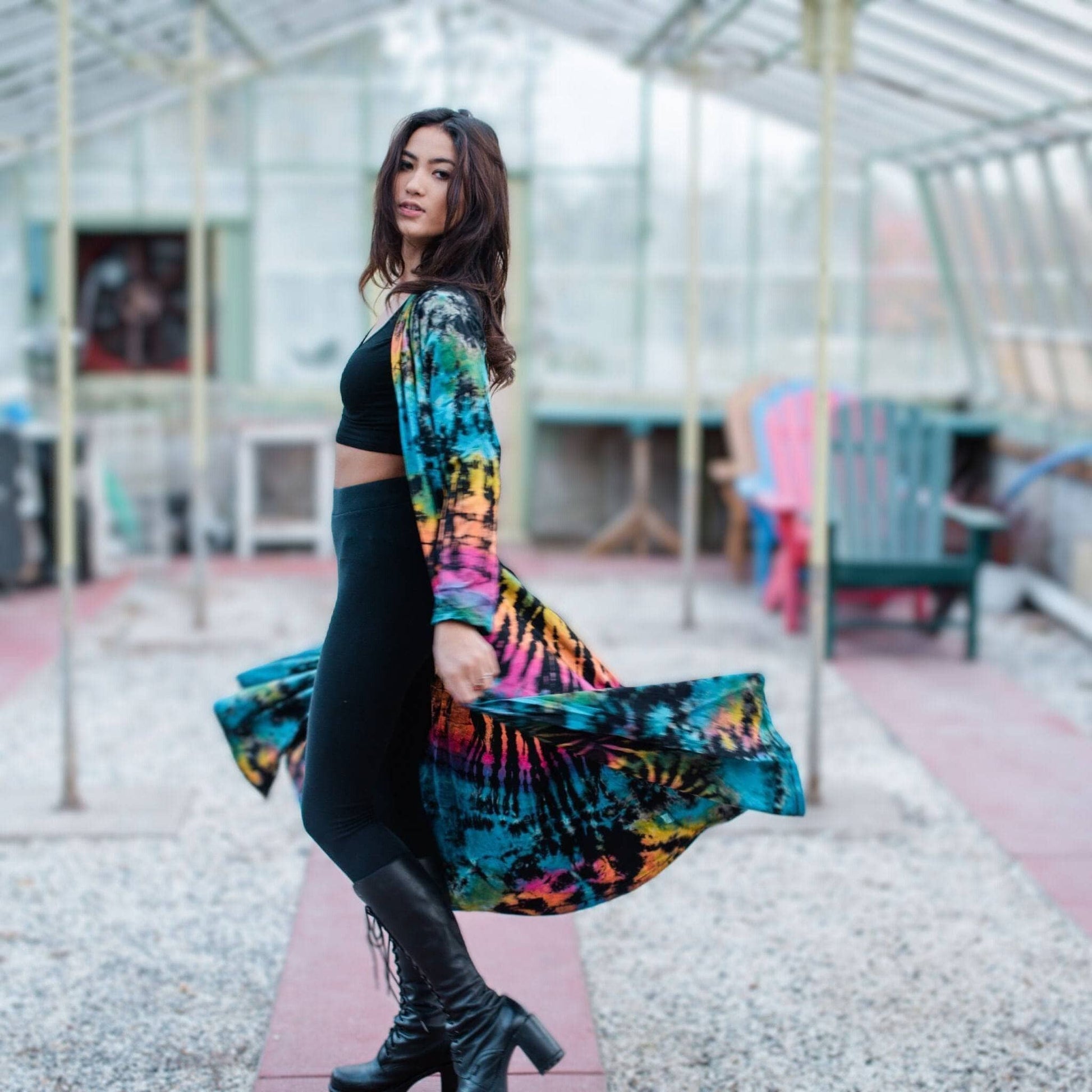 A woman wearing a cotton tie dye long cardigan.