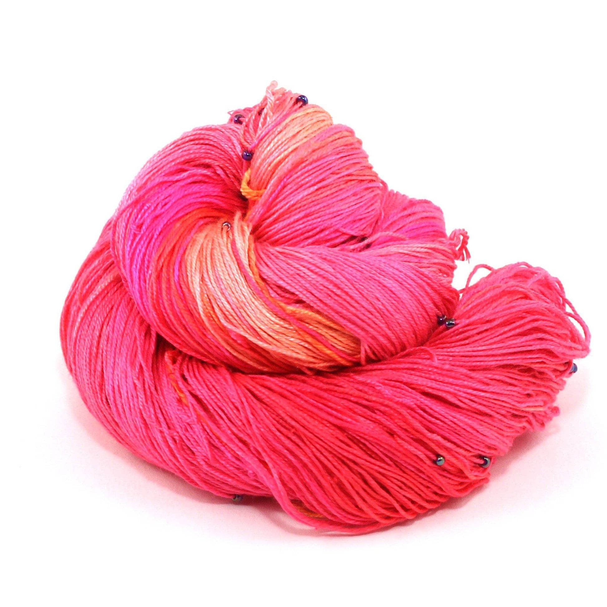 Hand Beaded Silk Yarn over a white background