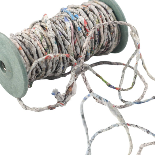newspaper yarn on a spool