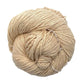 A skein of mulberry silk fingering yarn in the colorway 'bone' sitting on a white background.