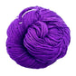 A skein of Mulberry silk fingering yarn in the colorway 'royal purple' on a white background.