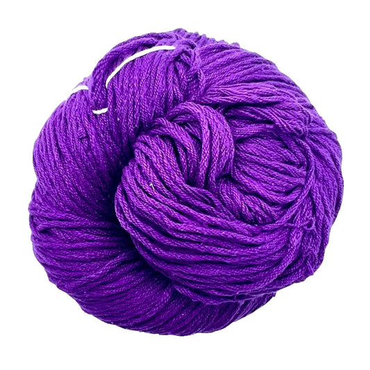 A skein of Mulberry silk fingering yarn in the colorway 'royal purple' on a white background.