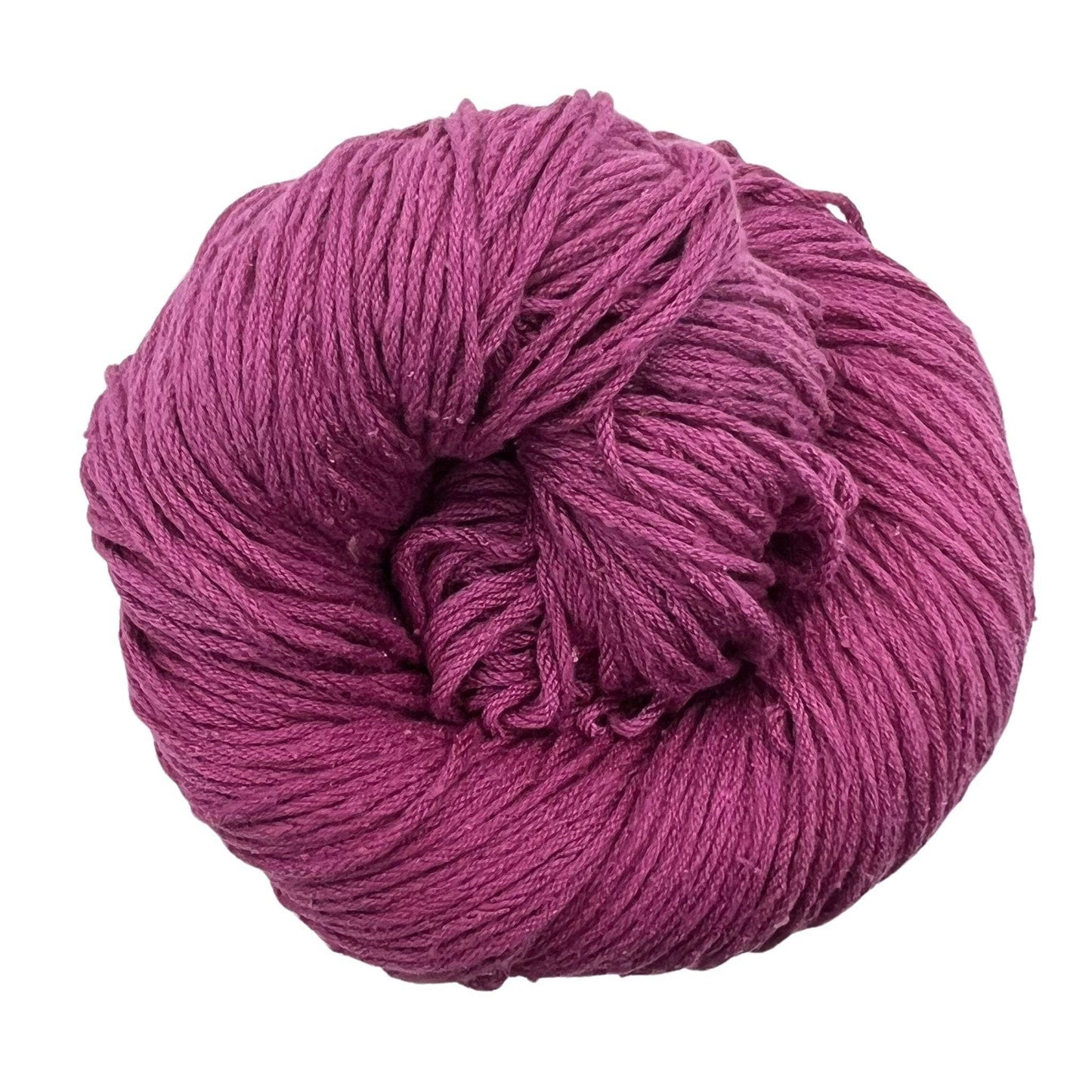A skein of Mulberry silk fingering yarn in the colorway 'soft pink' on a white background.