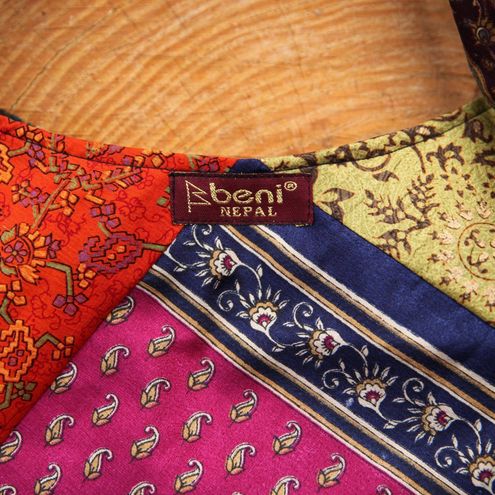 A close up of a clothe focused on the tag "beni NEPAL'