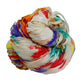 Tightly wrapped multi-colored silk fabric bundle with shades of red and blue.