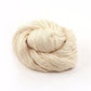 Lace Weight Silk Cloud Yarn donut ball in white on a white background