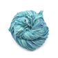 A used sky blue sari silk Yarn rolled.