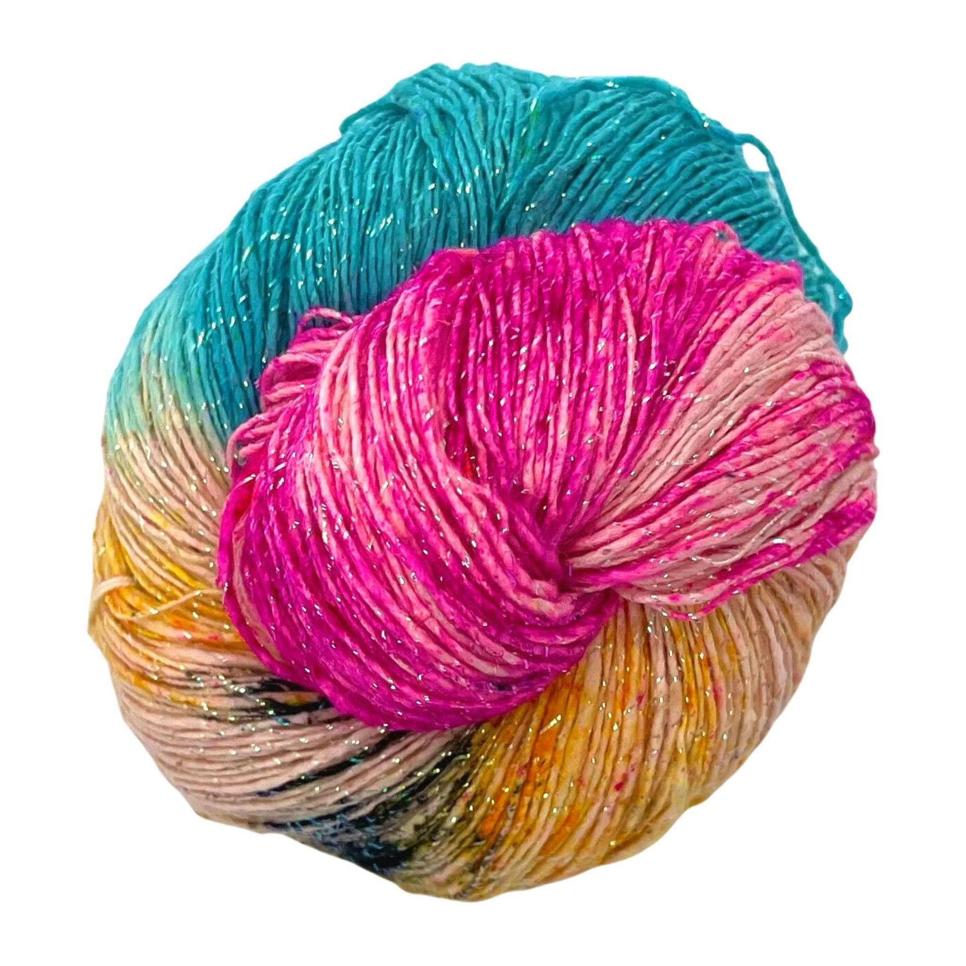 sparkle lace weight silk yarn in pink, yellow, and blue yarn with black speckles in front of a white background.