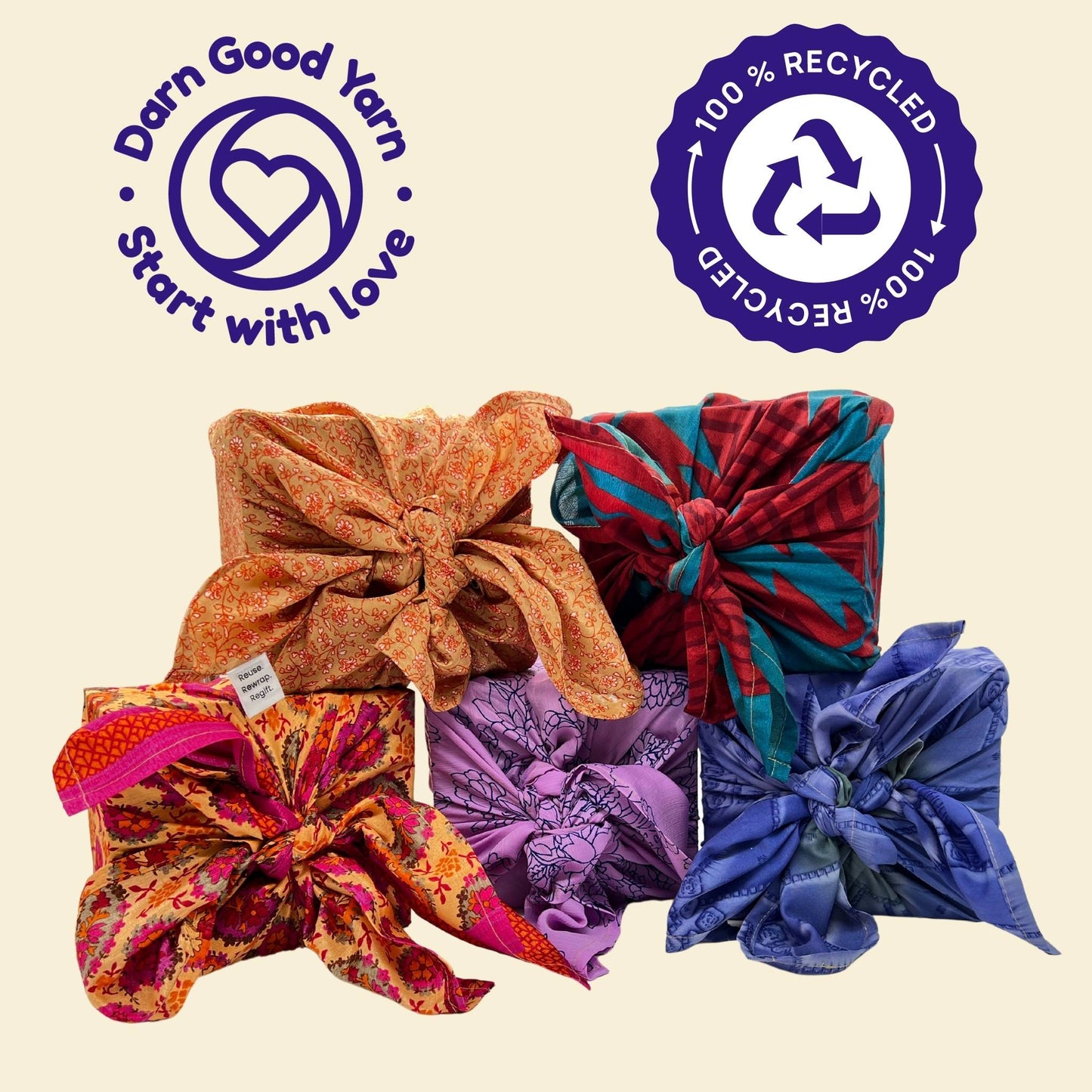 Five boxes wrapped in Furoshiki gift wrap in multiple colors on a cream colored backdrop. On the top of the page there is a darn good yarn logo and a recycle logo in purple. 