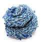 Blue and white yarn with blue beads and crystals throughout.