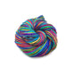 Lace weight silk yarn in color way exotic rainbow (multi-colored) in front of white background.