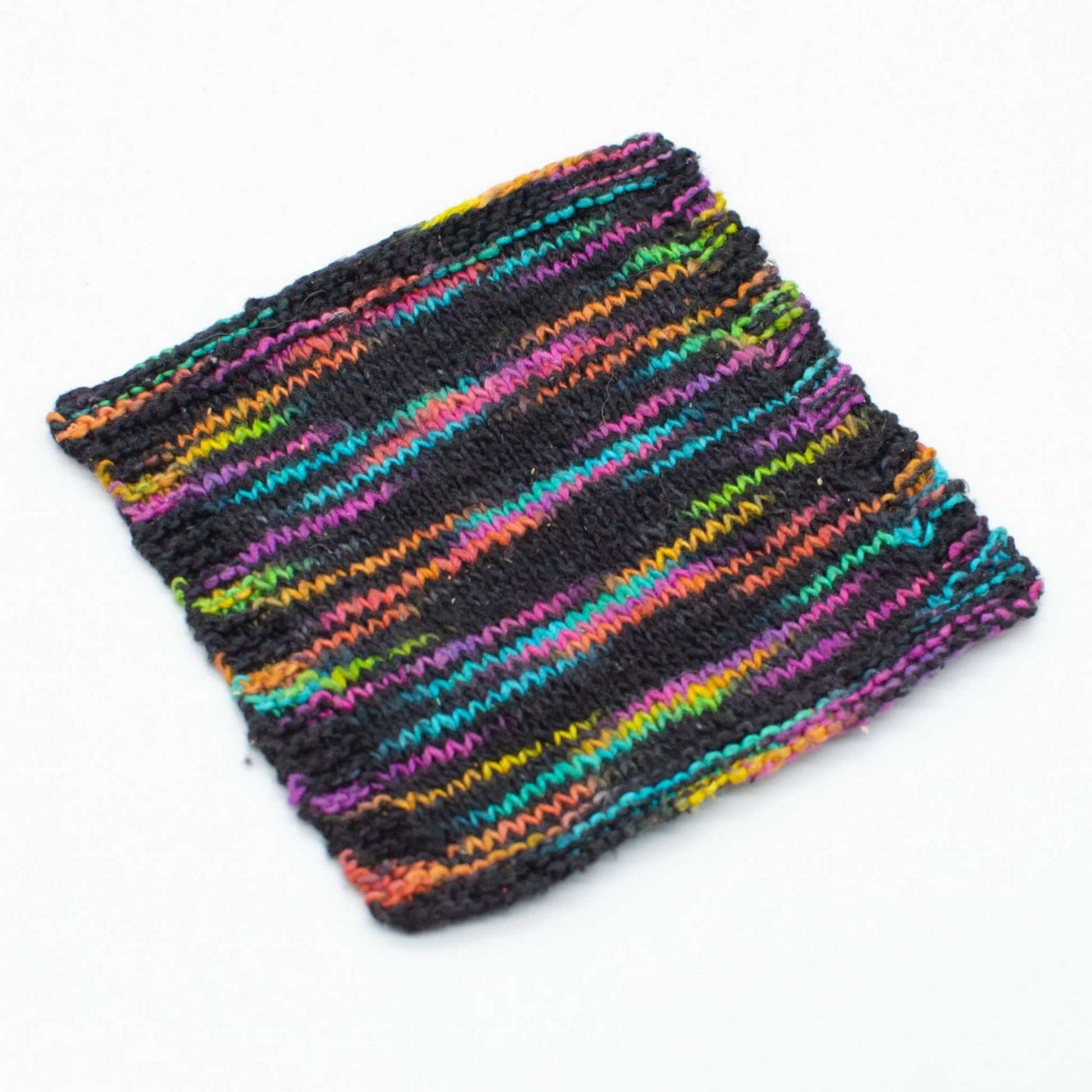 knit swatch of sunset lover peek a boo lace weight silk yarn (black and rainbow)