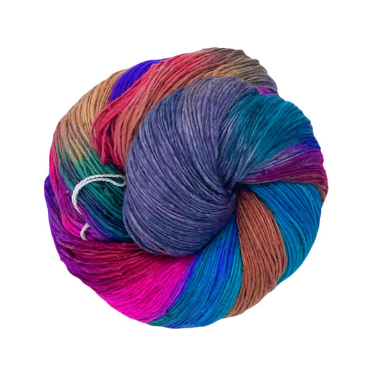A skein of lace weight yarn with grey, pink, magenta, purple, blue, tan, brown shade on a white background
