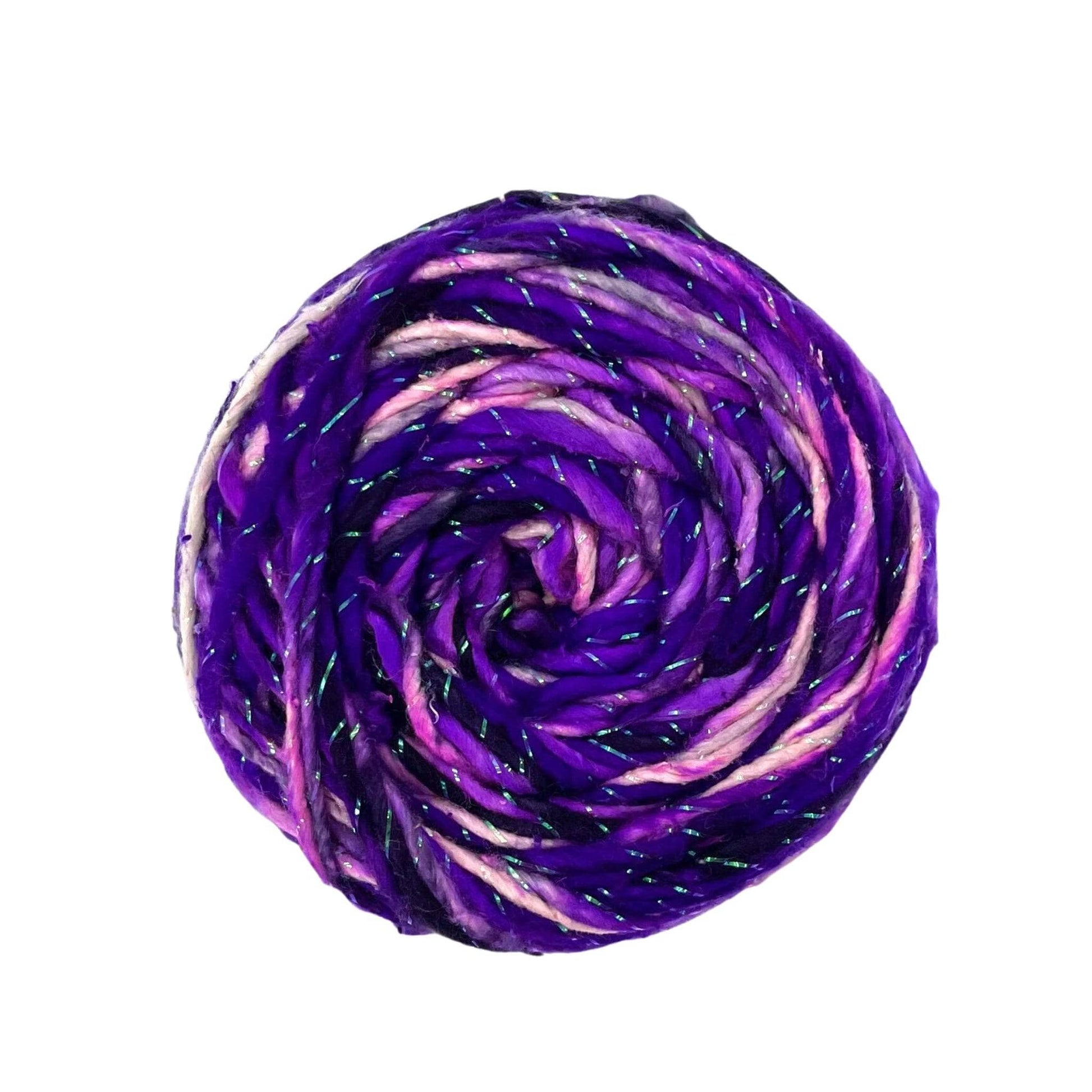 An overhead view of a cake of sparkle worsted weight silk yarn in the color Frostbite. This yarn is white and black with purple ombre dyed in. There is a strand of sparkle spun into this yarn.