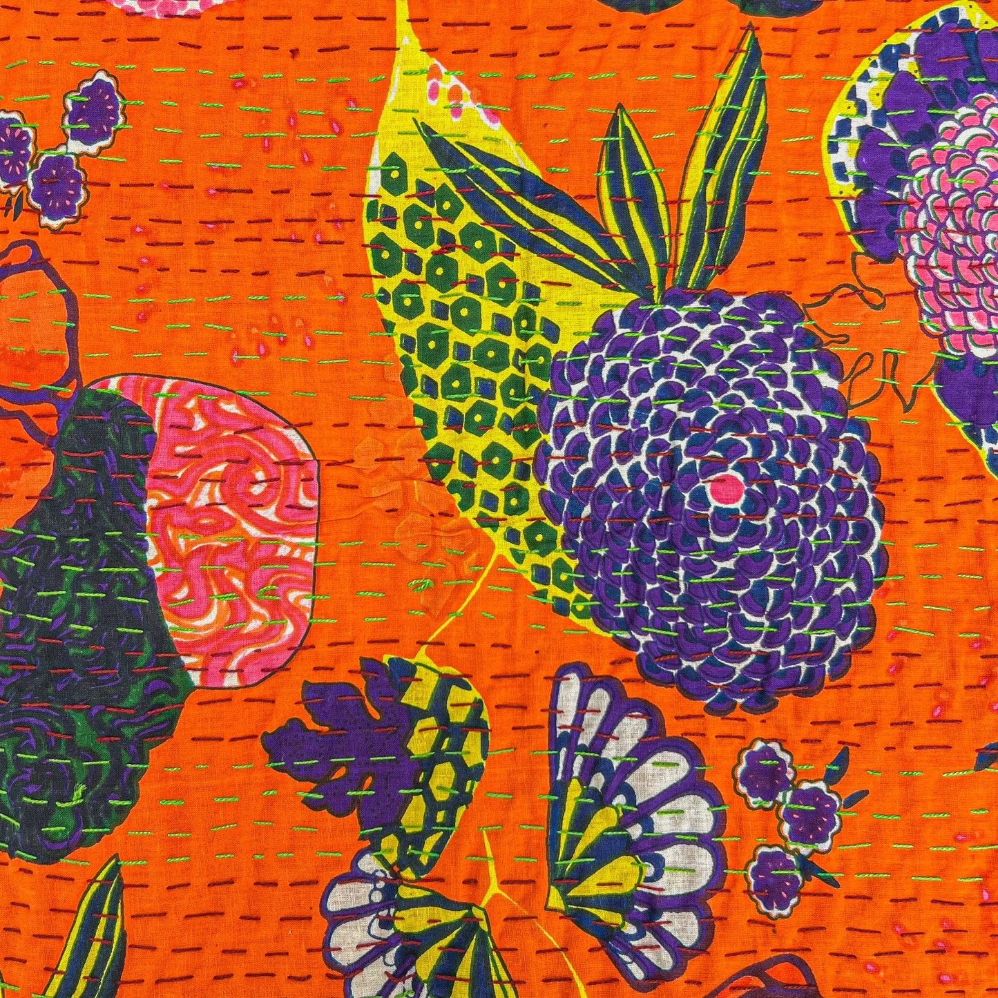 Close-up of orange symphony kantha pillow cover pattern.