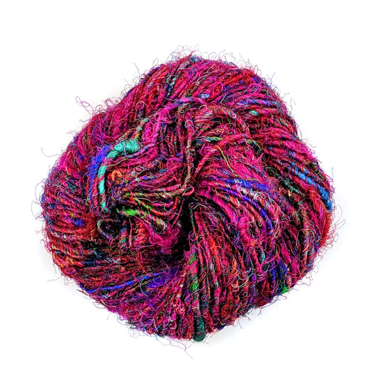 Premium handspun sari silk yarn that's been formed into a birds nest.