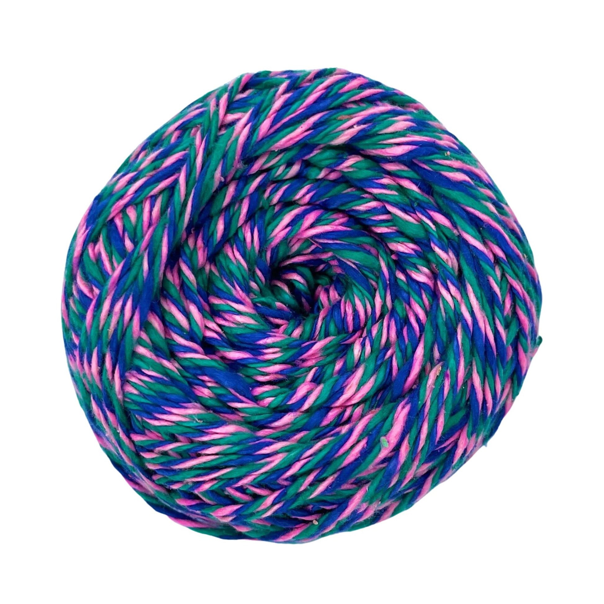 A skein of reclaimed silk yarn on a white background. The yarn is a triple ply yarn with pink, green and navy colors.
