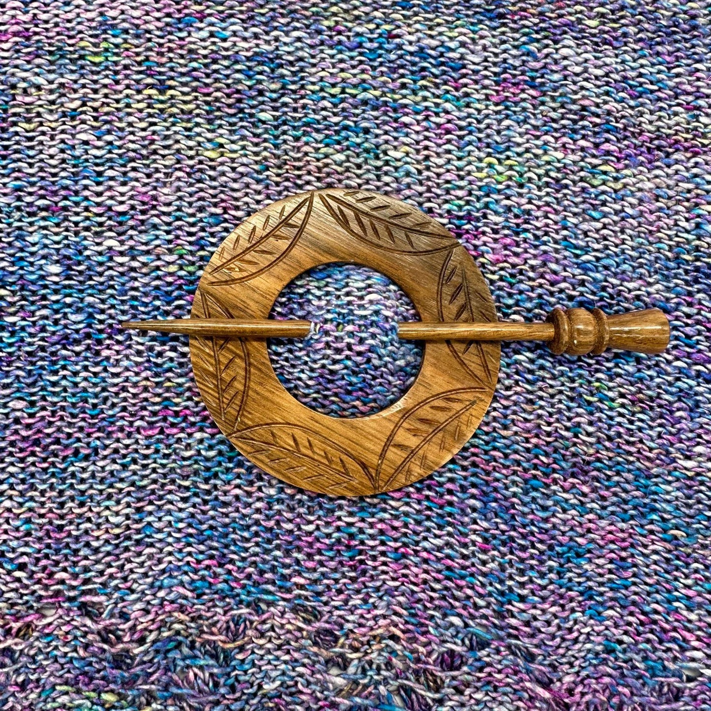 Stained Wooden Shawl pin attached to a shawl made of tidal pool lace weight silk yarn