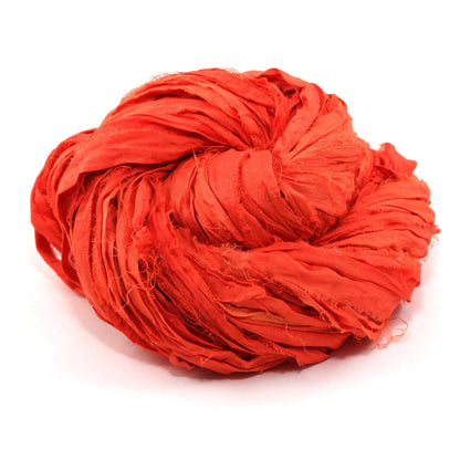 yarn cake in the color sodium orange with a white background