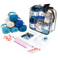 easy knit or crochet kit with all items showing in front of a white background. Ocean colorway contains 12 skeins of yarn, stitch markers, project bag, pattern booklet, knitting needles, crochet hook, tapestry needles, tape measure.