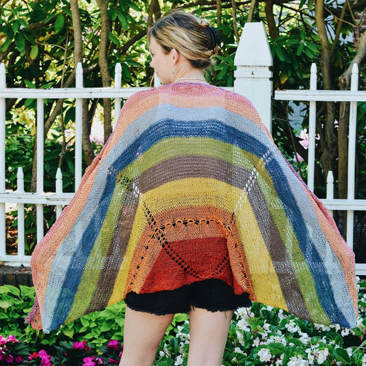Model wearing knit version of herbal dyed mini skein multipack herbal sunrise shawl