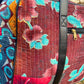 An up close shot of a Kantha Duffle Bag, showing the stitch work