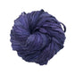 An ultra violet skein of sari ribbon on a white background